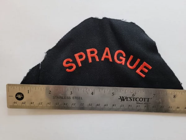 Shoulder patch from old uniform. Patch says "SPRAGUE".